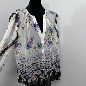 WHBM blouse with ruffle detailing along the sleeves.